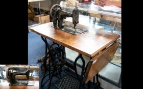 Antique Royal Derby Sewing Machine on Stand of typical form. Finished in black and gilt. Height 30