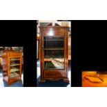 An Edwardian Display Cabinet.