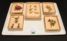 A collection of Kirks Folly signed Enamel and stone set Fairy Brooches ( 5 ) boxes In Total,