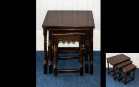 A Nest of Tables of plain form, the smallest table with scalloped apron detail,