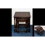 A Nest of Tables of plain form, the smallest table with scalloped apron detail,