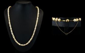 A Nice Quality Single Strand Pearl Necklace with a 14ct Gold Clasp and Safety Chain. From 1950's /