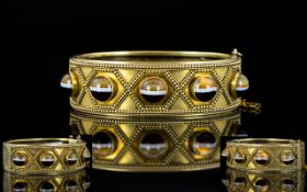 Scottish 19th Century Gilt Metal Banded Agate Set Aesthetic Hinged Bangle with Safety Chain.