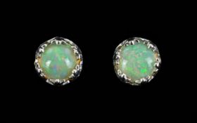Opal Pair of Stud Earrings, solitaire opals, each set in crown style,