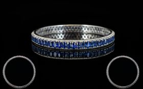 Sapphire Full Circle Bangle, 22cts of oval cut blue sapphires, set vertically in close formation, in