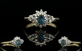Ladies 9ct Gold Diamond and Sapphire Cluster Ring. The Central Sapphire Surrounded by Small