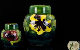 William Moorcroft Signed Tube lined Ginger Jar In The ' Hibiscus ' Pattern. c.1940.