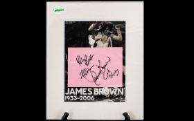 James Brown Autograph on a page displayed with with picture of the "Godfather of Soul".