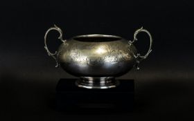 A Victorian Silver Plated Sugar Bowl Of globular form with etched scroll detail throughout.