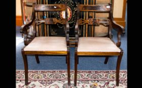 A Pair of Early 20th Century Mahogany Parlour Chairs of elegant form with scroll spindle arm rests