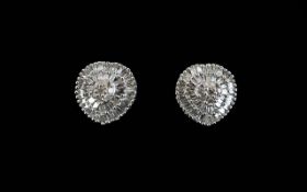 Pair of Diamond Cluster Earrings, a small, raised centre of round cut diamonds,