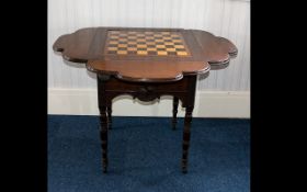 Antique Gaming Table with carved apron, turned legs on castors.