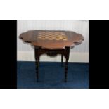 Antique Gaming Table with carved apron, turned legs on castors.