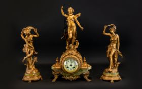 A French Spelter Figural Garniture Clock Set Raised on gilt and green onyx bases,