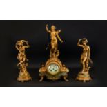 A French Spelter Figural Garniture Clock Set Raised on gilt and green onyx bases,