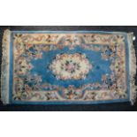A Large Woven Silk Carpet Keshan carpet on red ground with navy,