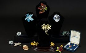A Collection Of Floral Themed Costume Jewellery A varied collection to include enamel leaf brooch by