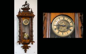A Late 19th Century Walnut Cased Vienna Wall Clock Cream chapter ring with Roman numerals,
