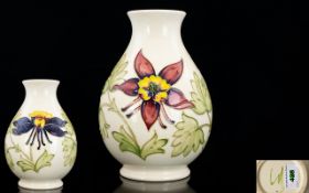 Moorcroft Tube lined Ovoid Shaped Vase ' Columbine ' Design on Ivory Ground. Signed to Underside. c.