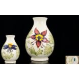 Moorcroft Tube lined Ovoid Shaped Vase ' Columbine ' Design on Ivory Ground. Signed to Underside. c.