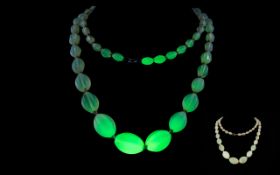 1930's Uranium Glass Bead Necklace Long art deco necklace of graduating ovoid beads with gold tone