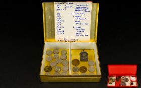 Dunhills Box containing numerous sixpencies, small silver coin,