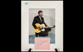 Chuck Berry Autograph on 1960s page displayed with photograph of singer.