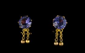 Ladies 18ct Gold And Amethyst Set Clip Earrings Comprising circular faceted amethyst stones,