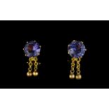 Ladies 18ct Gold And Amethyst Set Clip Earrings Comprising circular faceted amethyst stones,