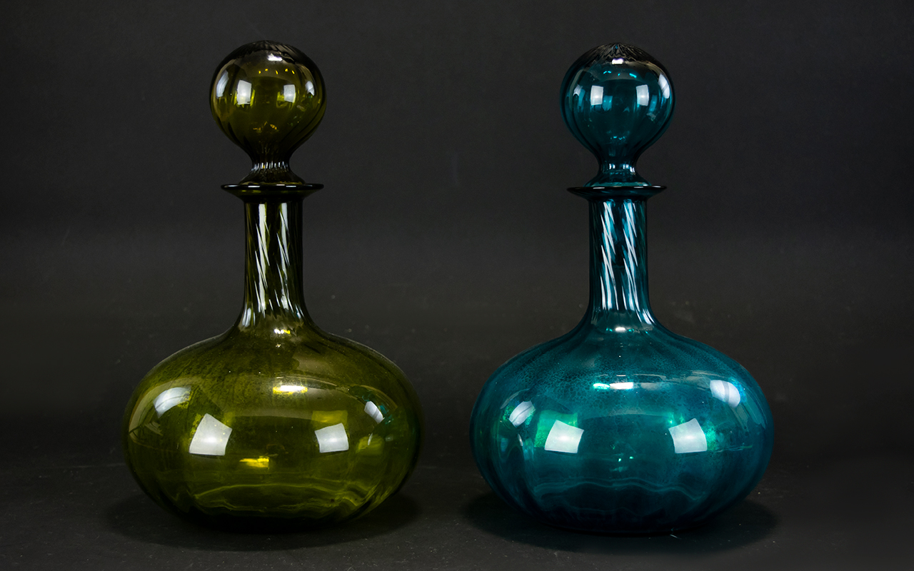 A Pair Of Onion Form Coloured Glass Decanters Large decanters with oversized spherical stoppers,