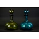 A Pair Of Onion Form Coloured Glass Decanters Large decanters with oversized spherical stoppers,