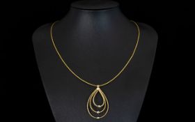 A Contemporary 9ct Gold Necklace Fine necklace with triple loop pendant detail strung with small