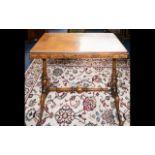 A Walnut Veneer Sofa Table.