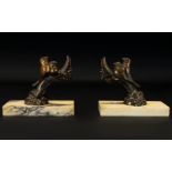 Art Deco Reproduction Bronzed Metal And Marble Bookends A pair of bookends raised on rectangular