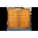 A Mid Century Teak Chest Of Drawers Designed By Peter Hayard. Comprising five long graduating
