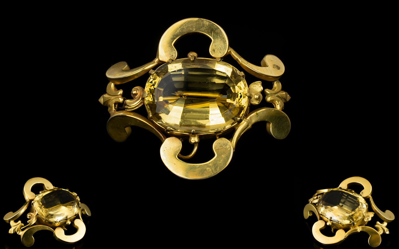 A Fine Late Victorian Brooch Set With A Large And Superb Oval Faceted Citrine The whole,