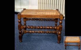 A Whicker Topped Occasional Table of rectangular form with turned legs and stretcher with woven