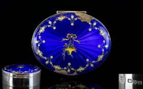 Sterling Silver Oval Shaped Hinged Lidded Box with Enamel Top Inlaid In Gold and Silver Floral