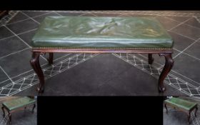 Victorian Walnut Duet Stool Of typical form, upholstered in green leather with carved cabriole legs.