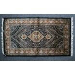 Woven Wool And Silk Blend Carpet Small rectangular rug in traditional Persian design with four