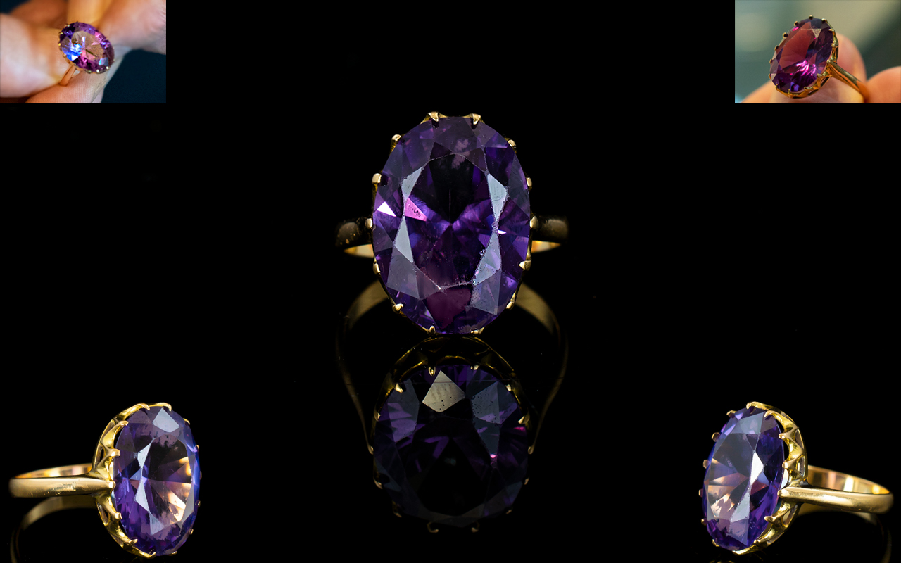 An 18ct Gold And Amethyst Set Cocktail Ring the whole set in raised reticulated mount,