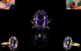 An 18ct Gold And Amethyst Set Cocktail Ring the whole set in raised reticulated mount,