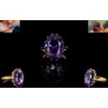 An 18ct Gold And Amethyst Set Cocktail Ring the whole set in raised reticulated mount,