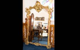 Regency Period George III Gilt Gesso Mirror Of very large proportions with ornate scroll,