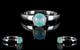 Opal Solitaire Ring, a classic 1ct opal cabochon in a raised,
