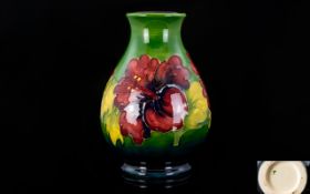 William Moorcroft Signed - Tube lined Ovoid Shaped Vase In The ' Hibiscus ' Pattern. c.1940.