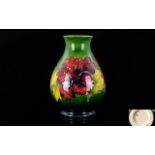 William Moorcroft Signed - Tube lined Ovoid Shaped Vase In The ' Hibiscus ' Pattern. c.1940.