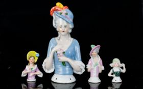 Ceramic Half Boudoir Doll Along With Three Miniature Examples Early 20th century half doll in