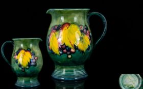 William Moorcroft 1930's Signed Jug ' Leaf and Berries ' Design on Green / Blue Ground with