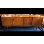 G Plan Sideboard Typical Form, Fall Front, Four Drawers And A Cupboard, Raised On Turn Legs.